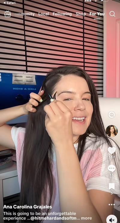 Ana in pink shirt getting hair done for Billie Eilish collab
