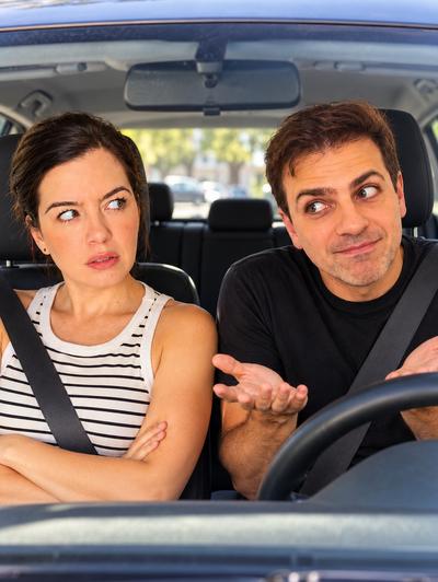 Couple arguing in car — she's arms crossed, he's gesturing explaining — comedy sketch