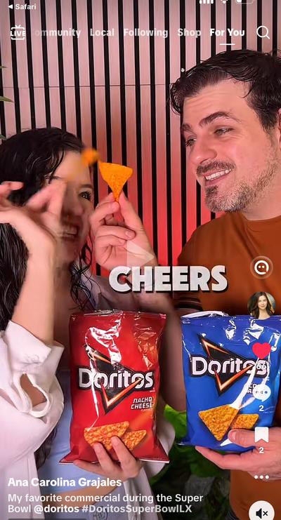 Ana and partner holding Doritos bags doing a Super Bowl collab