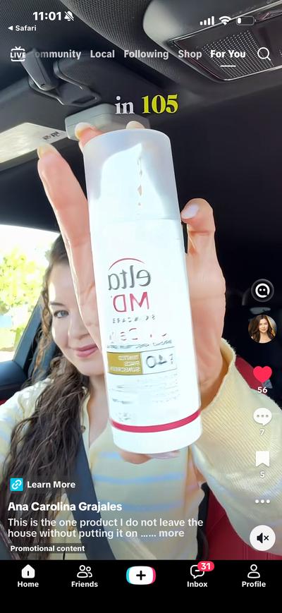 Ana holding EltaMD sunscreen bottle