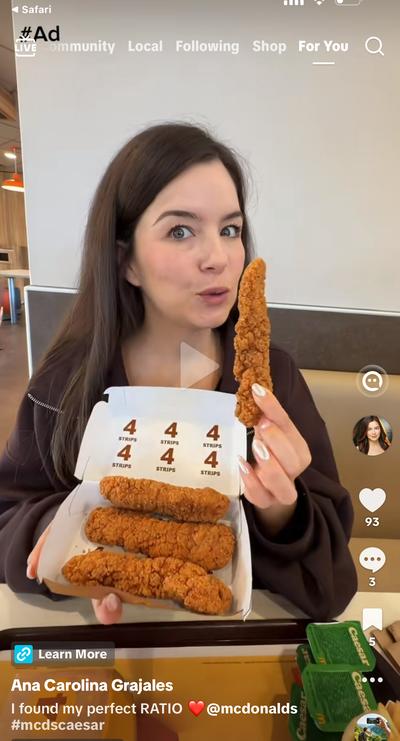 Ana holding McDonald’s chicken strips at a restaurant