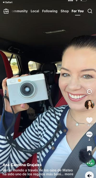 Ana in car holding My First instant camera