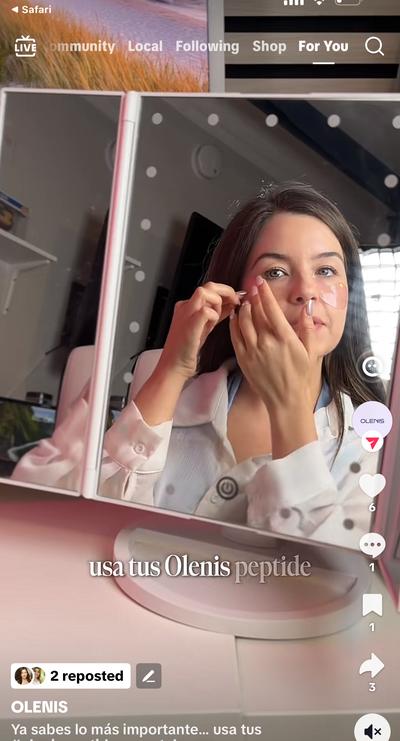 Ana applying Olenis patch at mirror