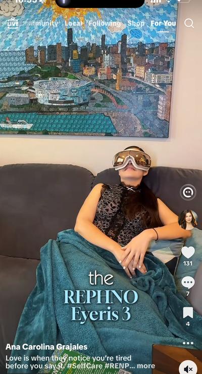 Ana relaxing on couch with Renpho Eyeris 3 eye massager