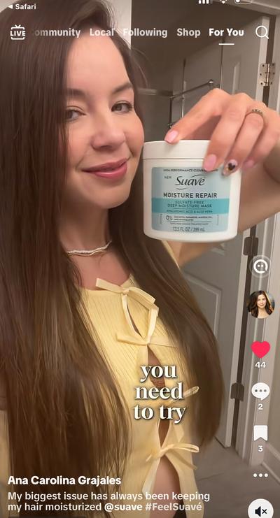 Ana holding Suave Moisture Repair hair mask jar in yellow top