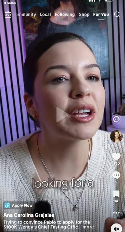 Wendy's Comedy Sketch in white sweater purple wall